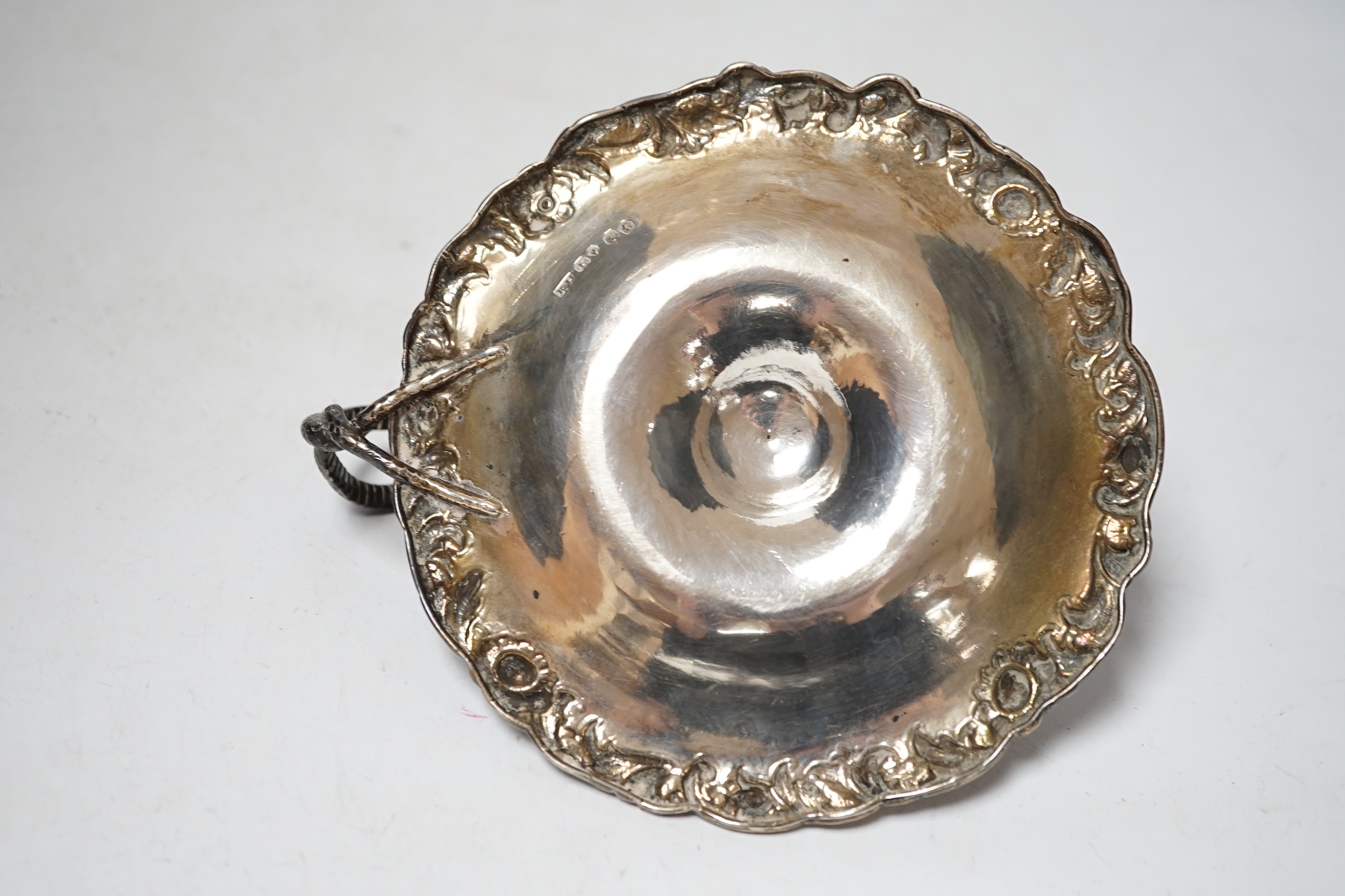An early Victorian silver chamberstick, Robert Hennell III, London, 1842, with foliate border, 13.8cm, lacking snuffer, 5.9oz.